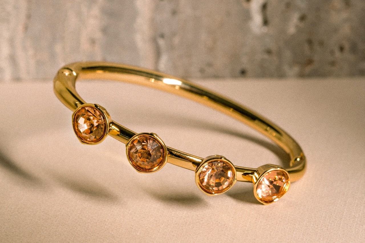 close up image of a yellow gold fashion ring with round cut citrine