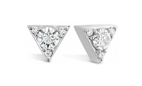 A pair of triangular Hearts on Fire stud earrings, available at Long Jewelers.